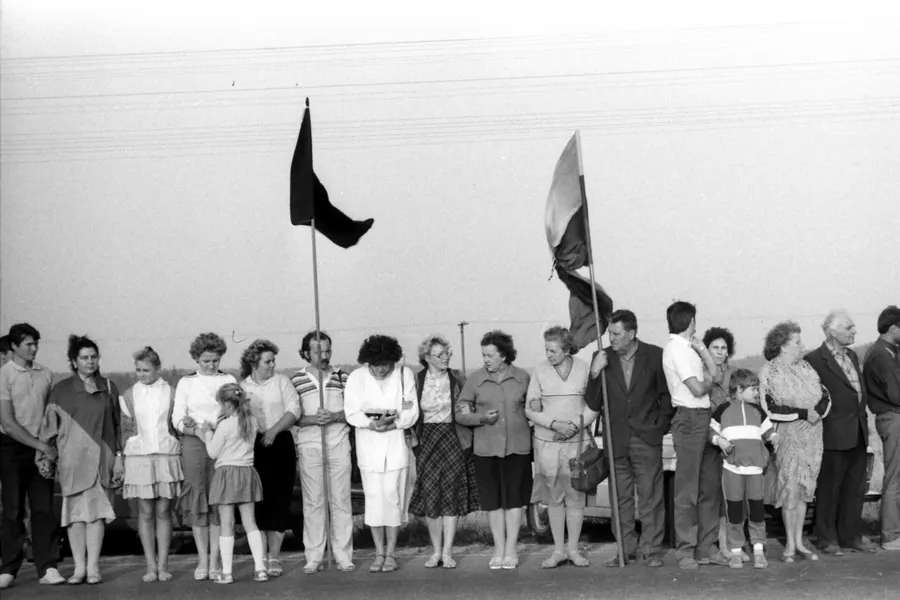 People in Lithuania join hands in the Baltic Way, the human chain across the three Baltic states, on 23 August 1989