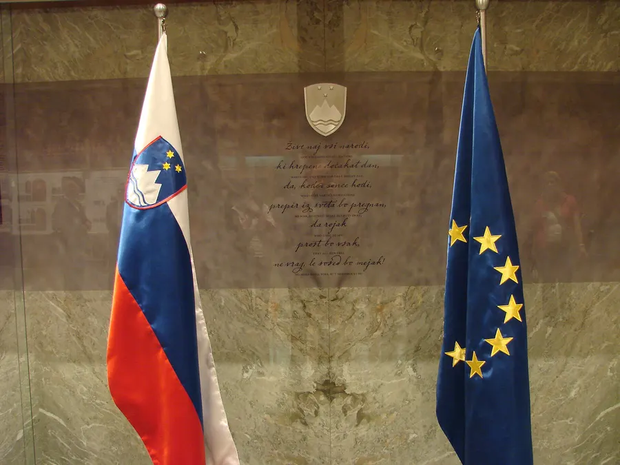 The flags of Slovenia and the European Union inside Slovenia's National Assembly building in Ljubljana