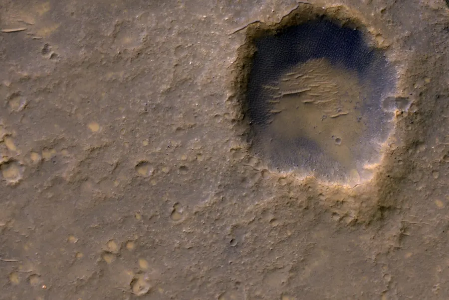 Spirit's empty lander platform (lower left) near Bonneville crater on Mars, photographed from orbit by NASA.