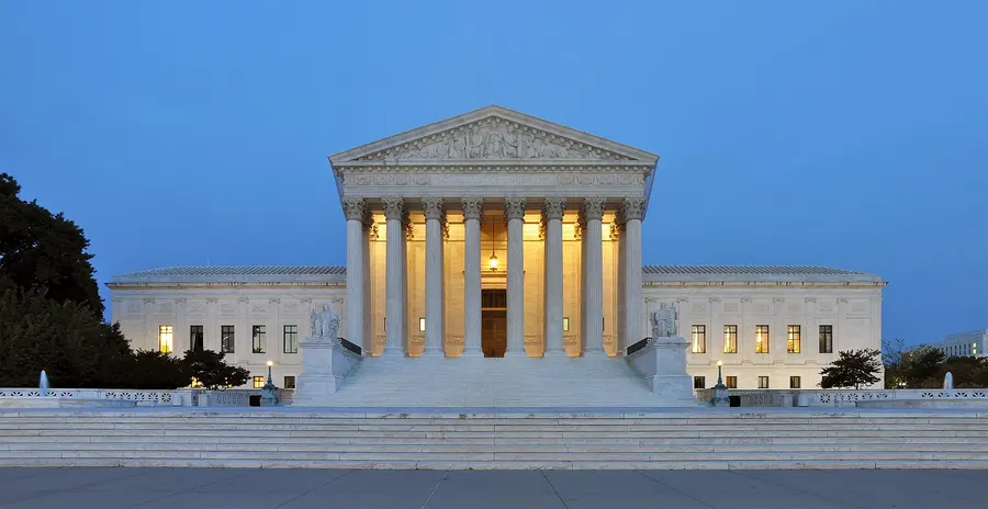 The United States Supreme Court building in Washington, DC, at dusk.