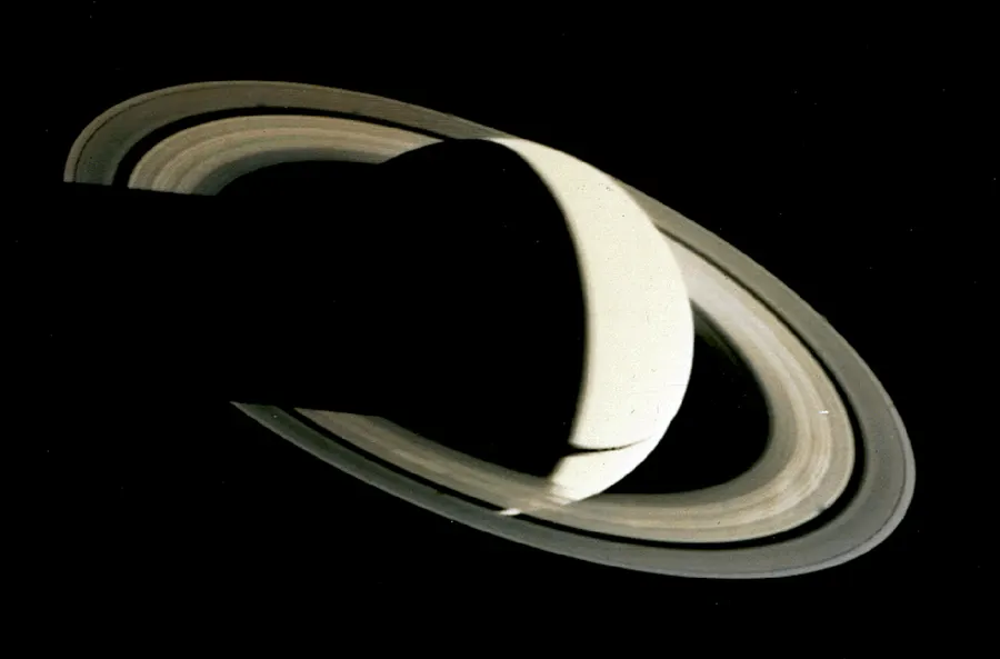 Saturn as a crescent, photographed by Voyager 1 after its closest approach.