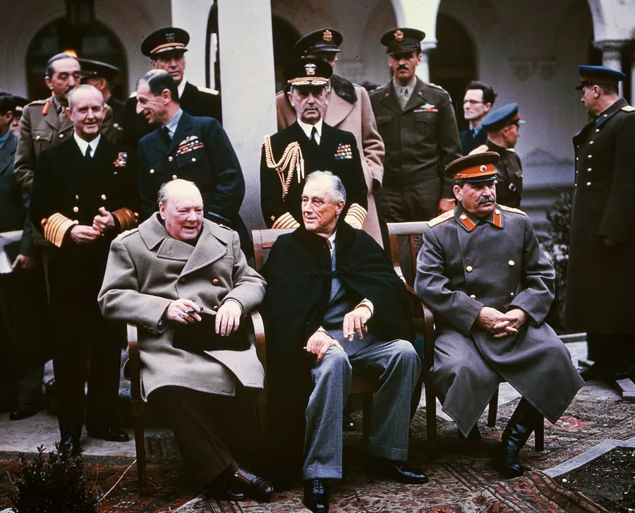 Winston Churchill, Franklin Roosevelt and Joseph Stalin at Yalta, February 1945, with their military and diplomatic staff behind them.